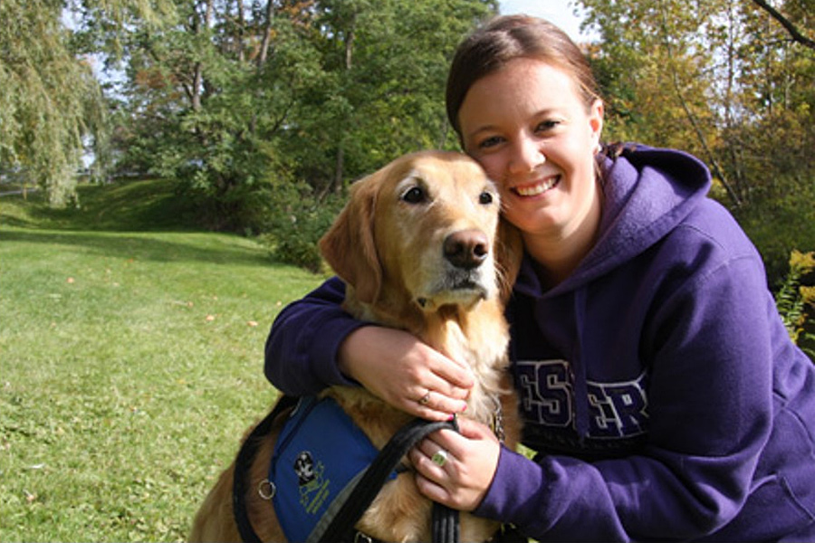 Female Western Student with her Golden Retriever seeing eye dog
