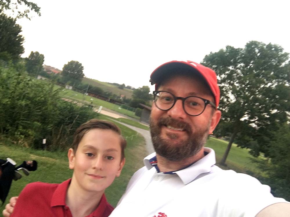Mark Staudenmann with son on golf club photo