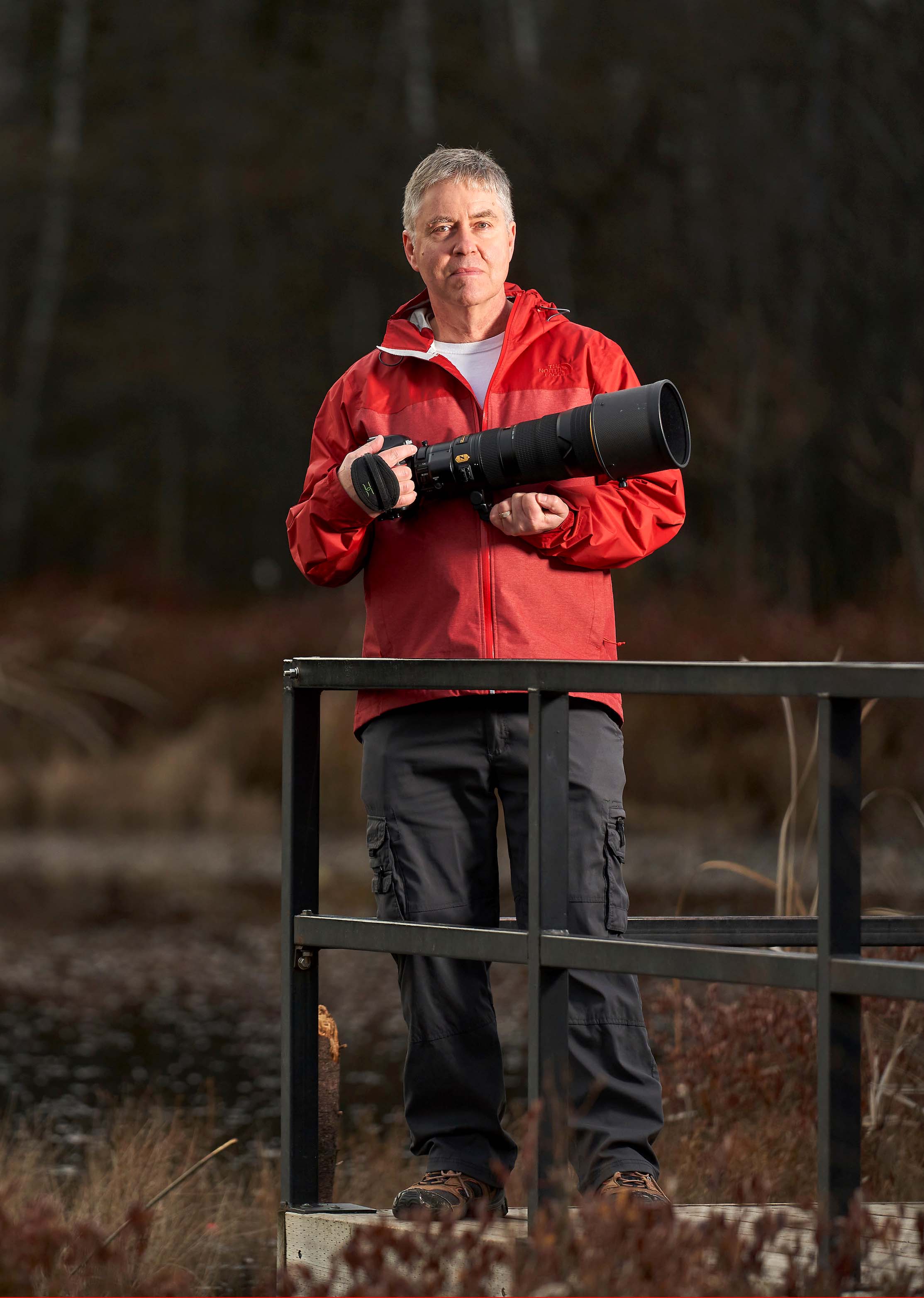 Bill Boswell in park with camera photo