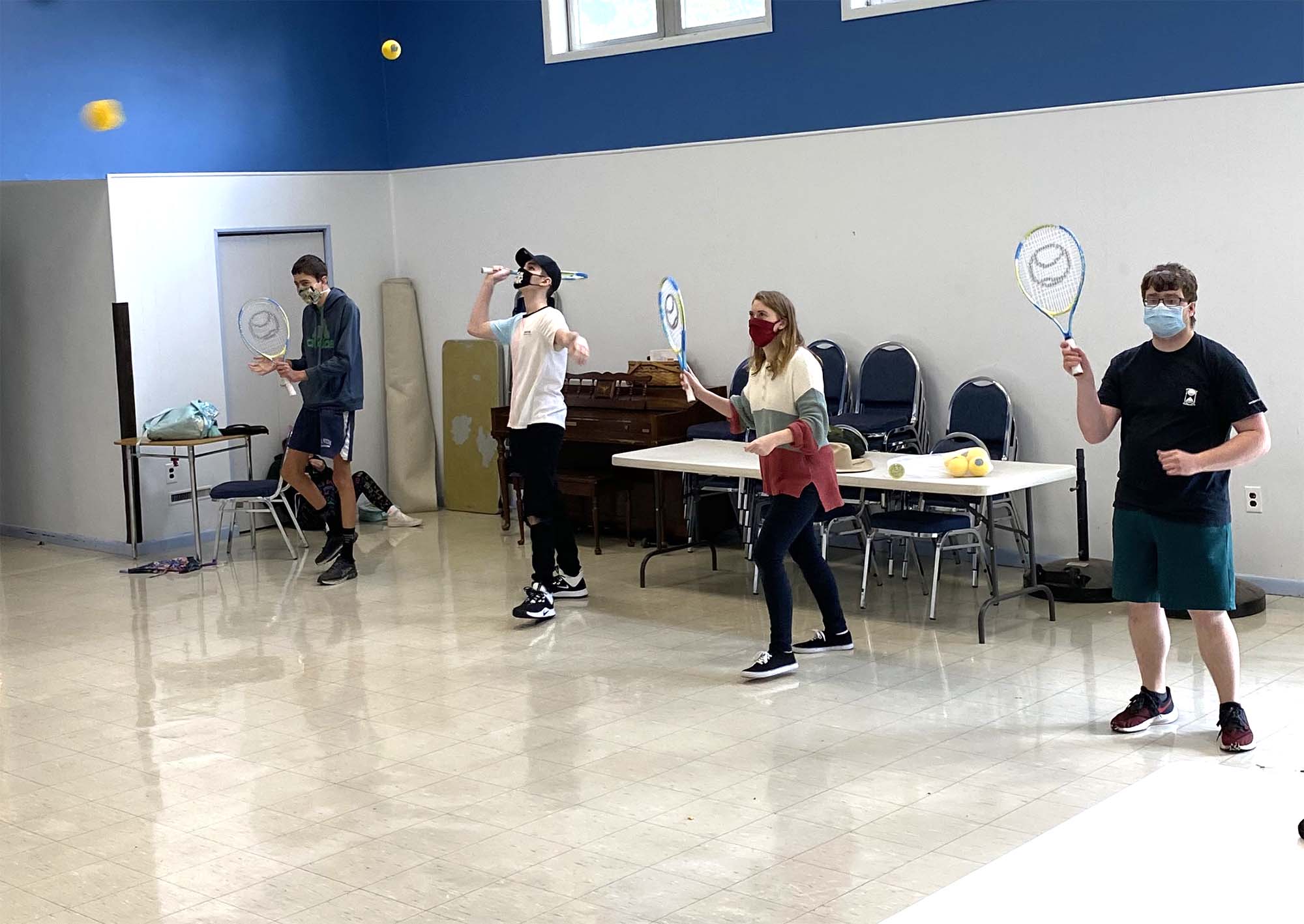 Kids playing tennis in The Concept School