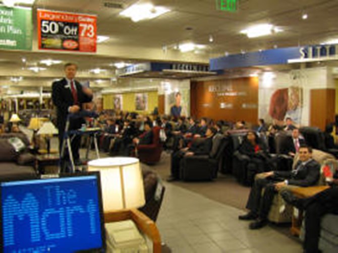 Students attend a Q&A session at the Nebraska Furniture Mart