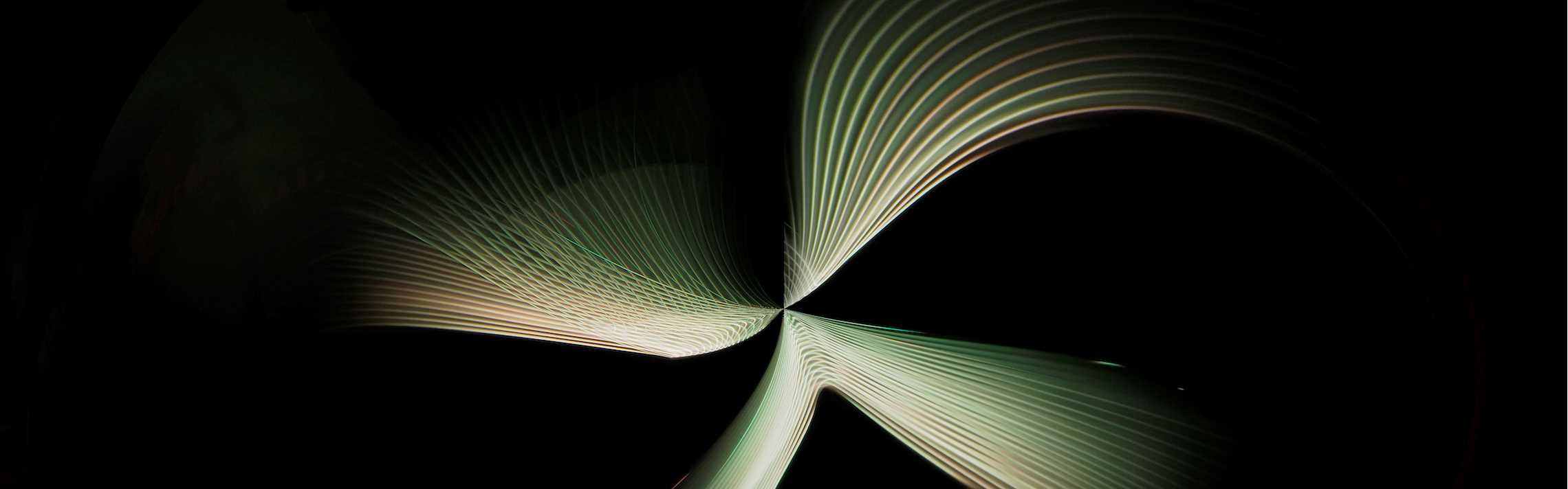 abstract green swirl with black background
