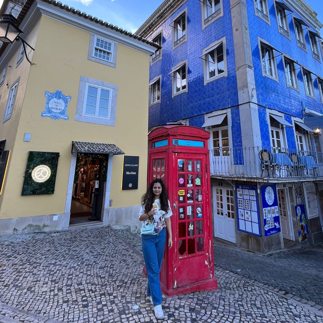 Gazzal in front of some colourful buildings in Portugal