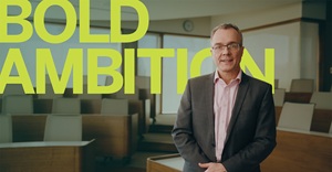 Julian Birkinshaw with the words Bold Ambition behind him