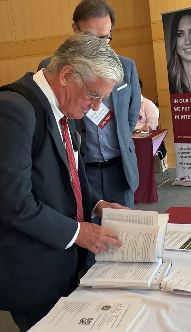 George Athanassakos speaking to a Conference attendee about his new value investing book