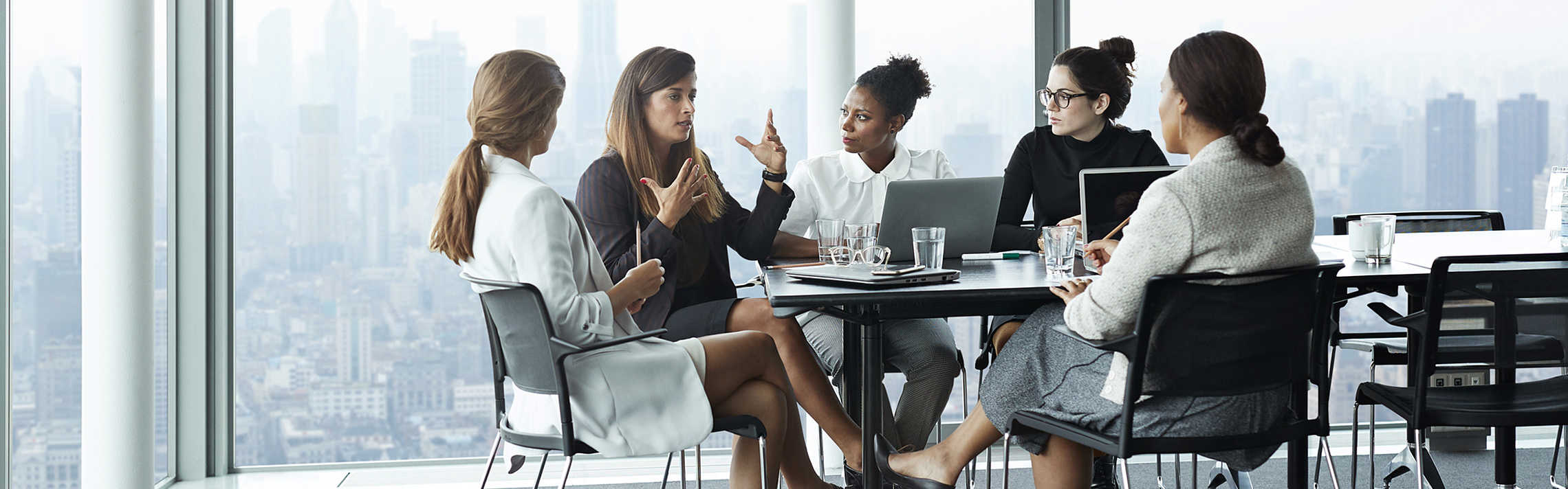 A group of woman having a meeting in the office.