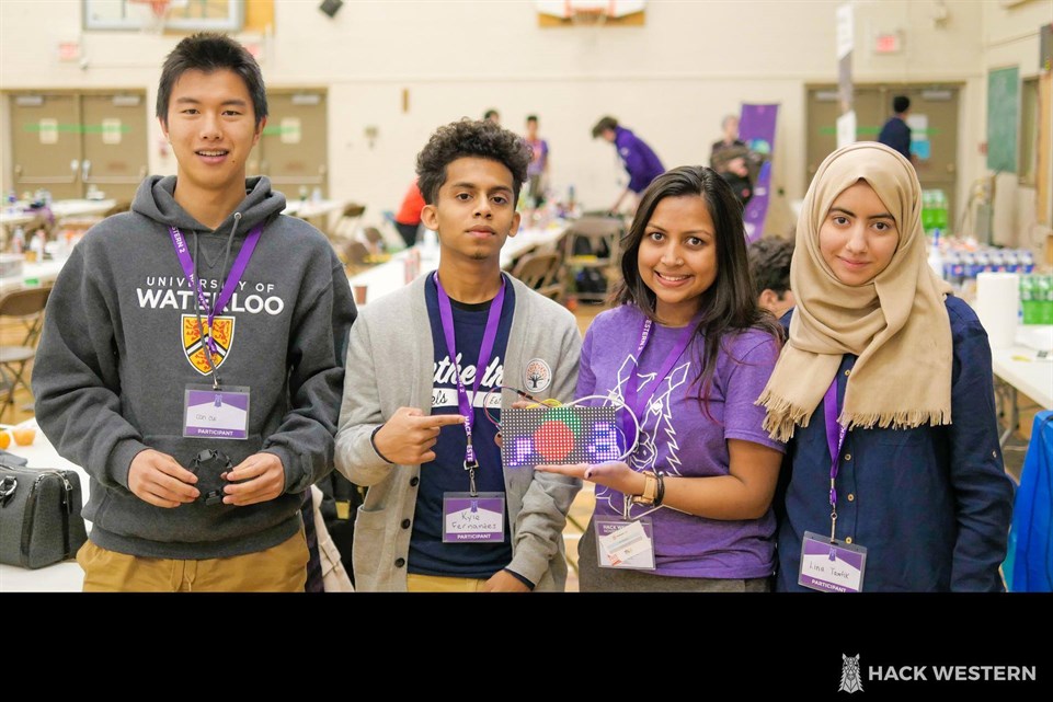 Students smiling for the camera at Hack Western