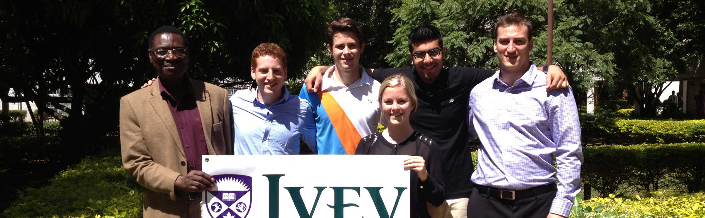 Students holding a sign