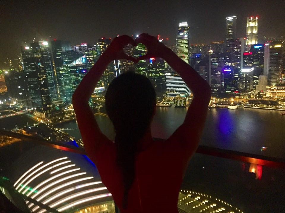 On top of the Marina Bay Sands with a beautiful view of the city, Singapore