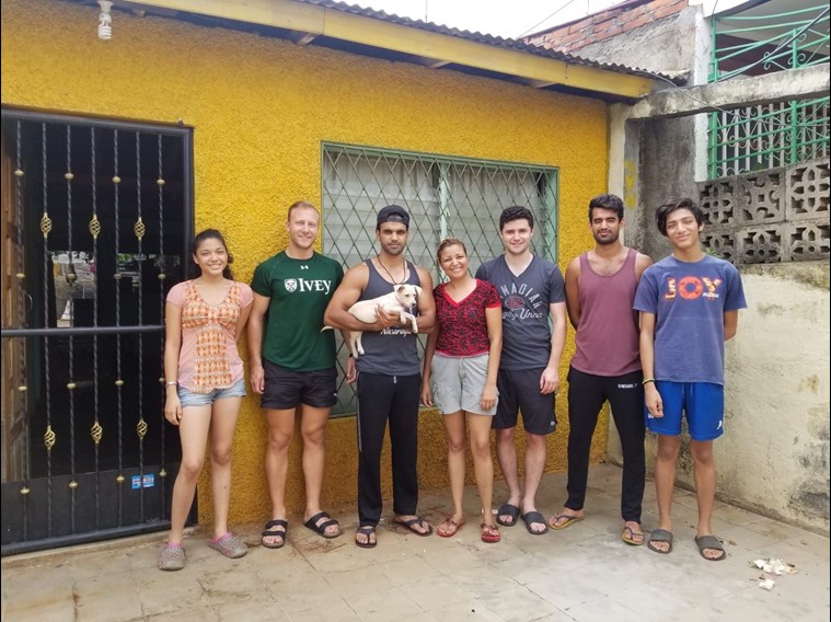 A group of students outside a house