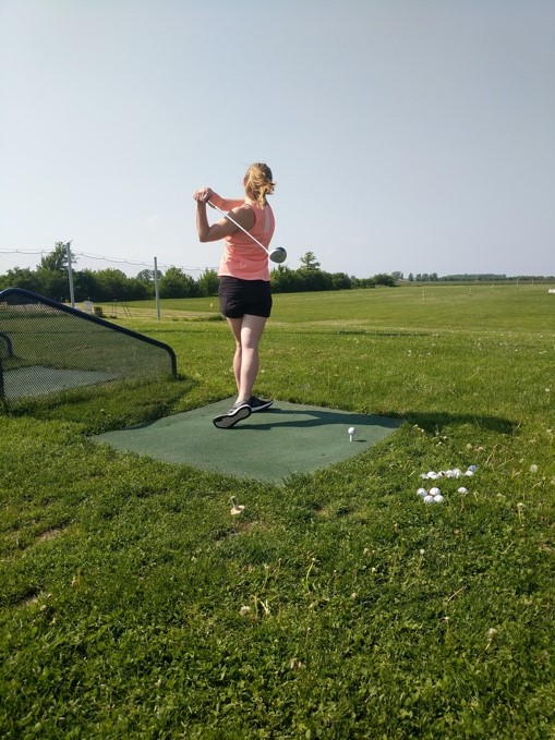 Corinne Peters at the driving range