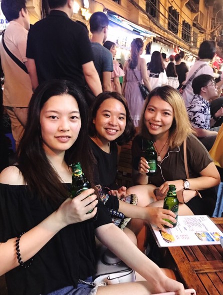 Three women having a drink at a patio