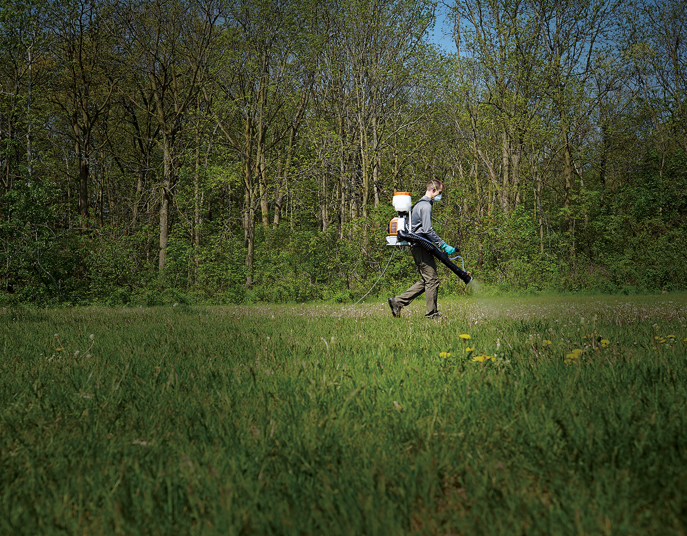 Trevor Davis using chemicals in a field