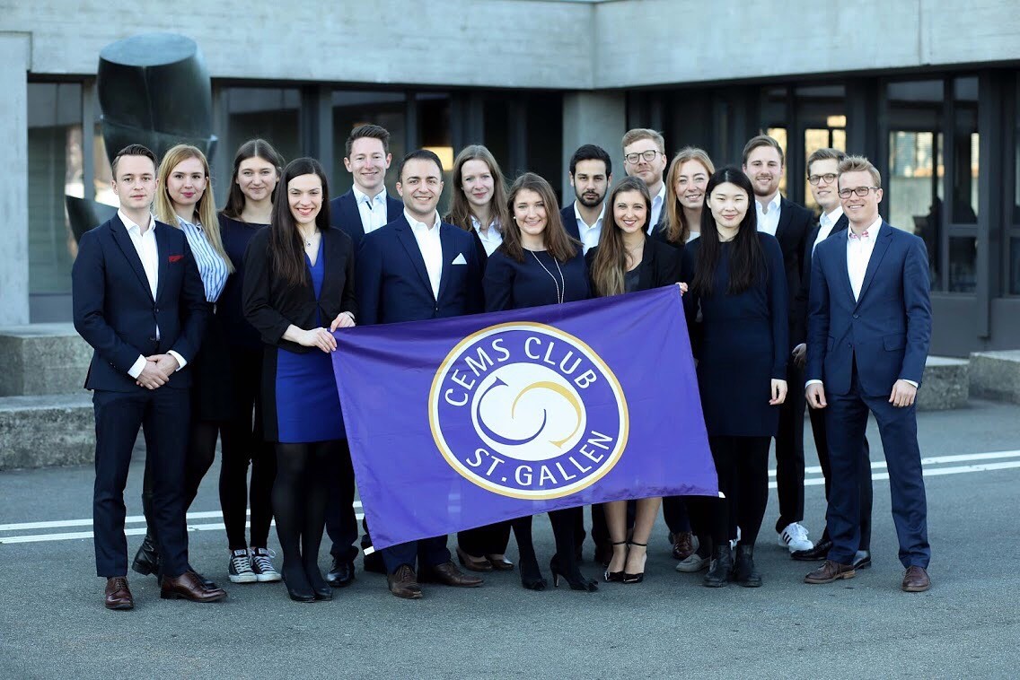 A group ot students holding a CEMS Club banner