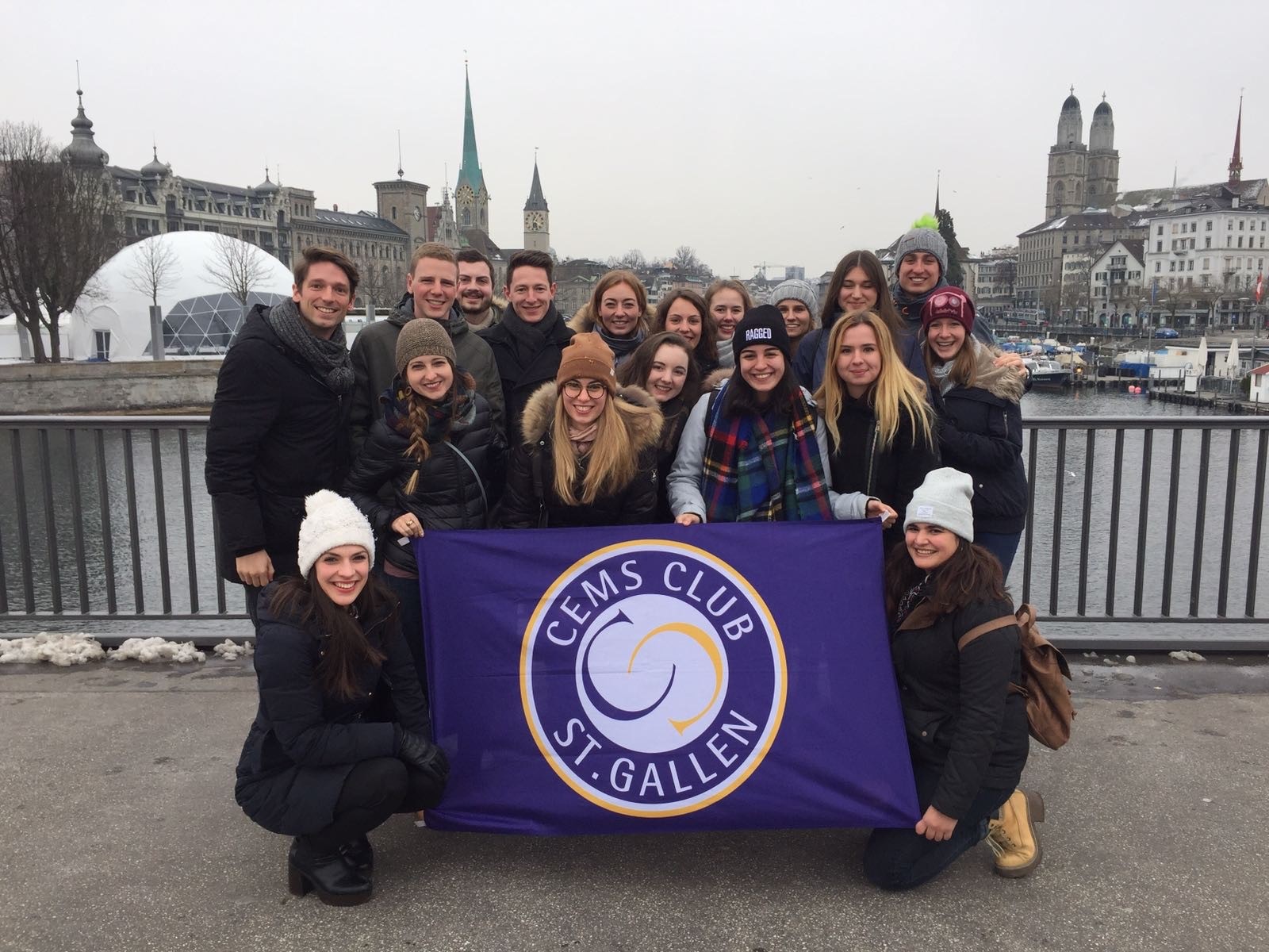 A group ot students holding a CEMS Club banner