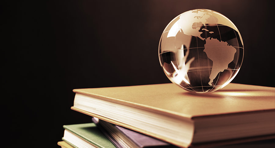 Image of a crystal globe sitting on some books
