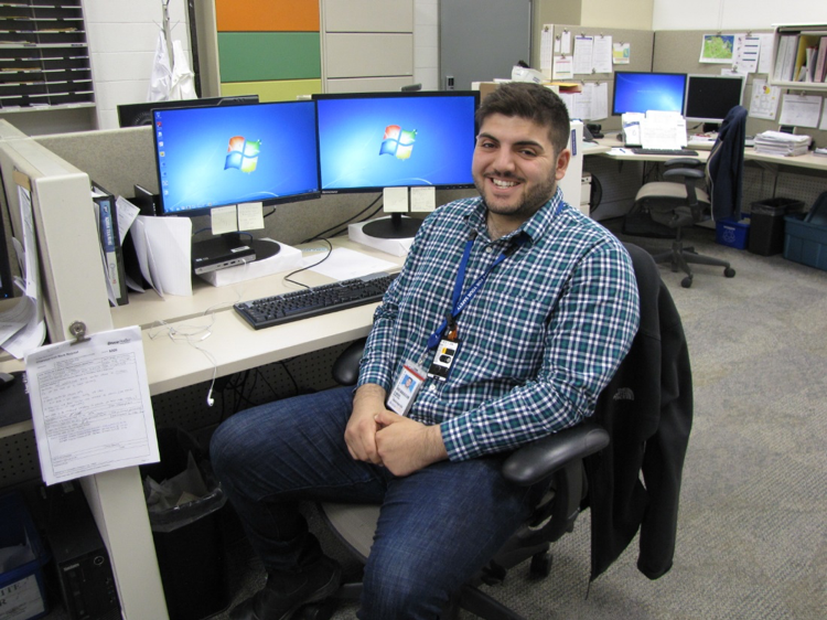 Photo of Jonathan Obeid at his desk at Bruce Power Plant