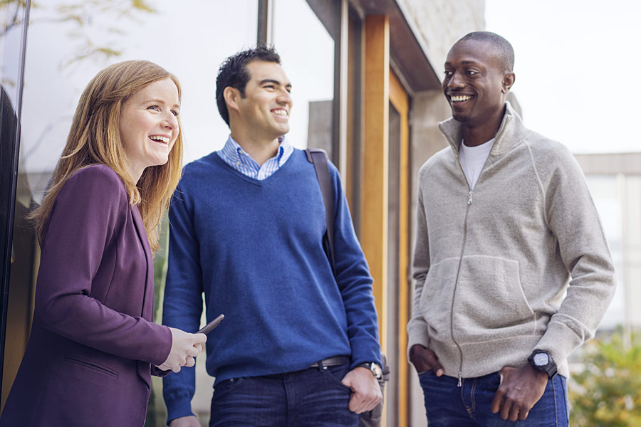 Three Ivey students talking at the Ivey Business School