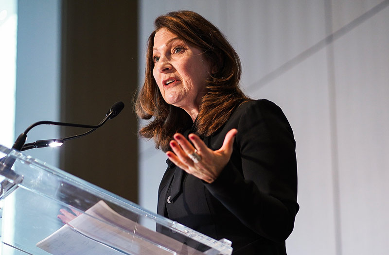 Anna Maria Tremonti speaking at a podium