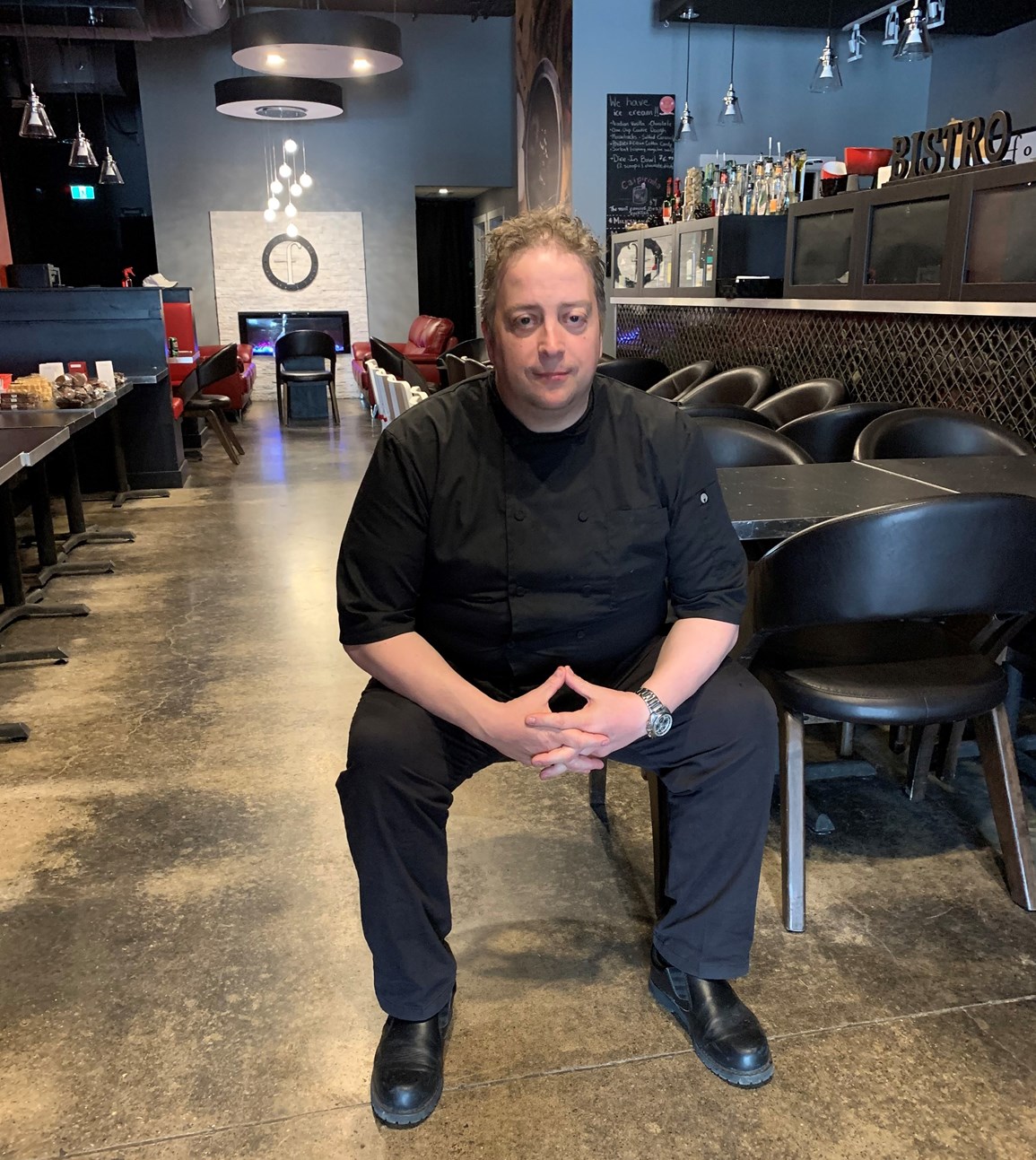 Image of Marc Forrat sitting in a bistro