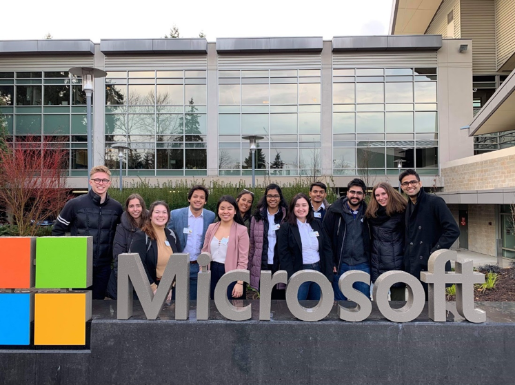 Students standing outside Microsoft sign