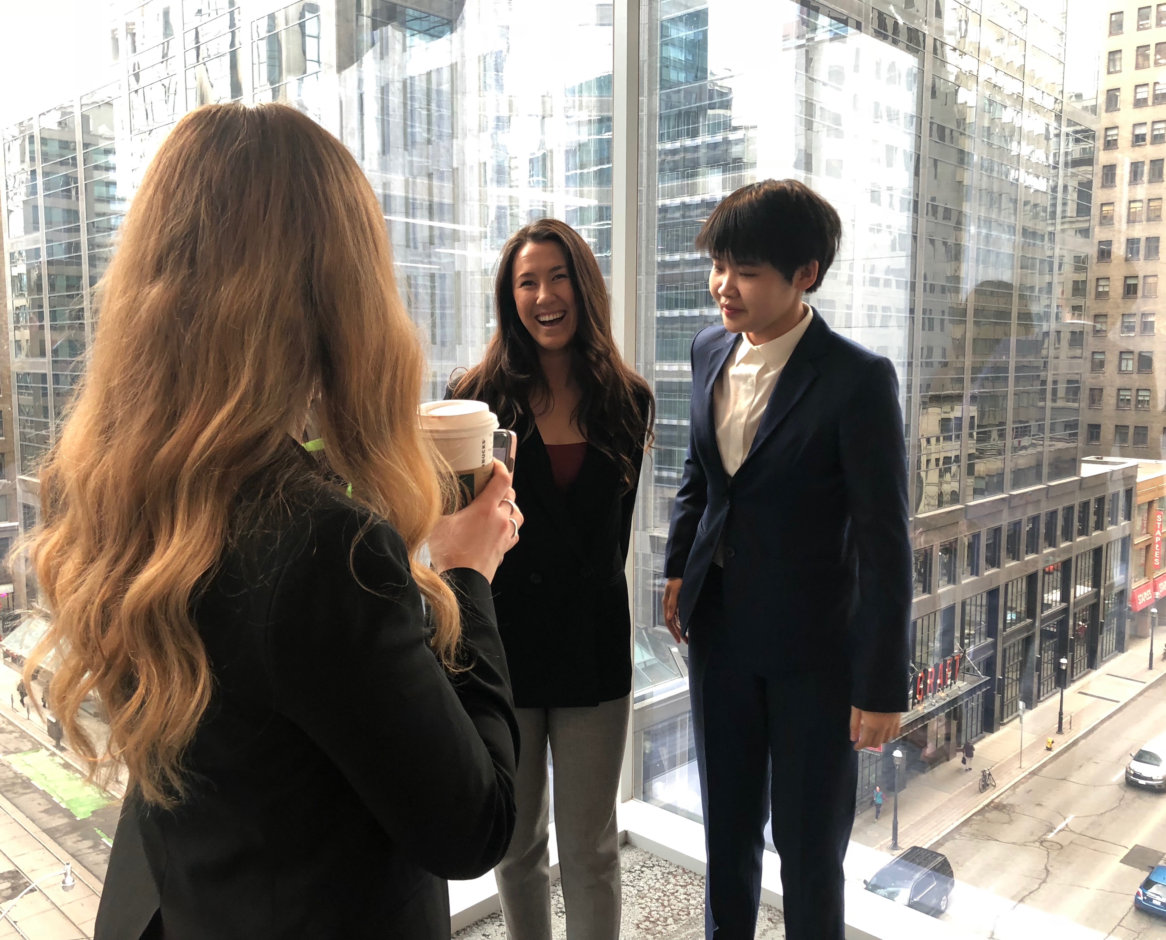3 female students stand talking