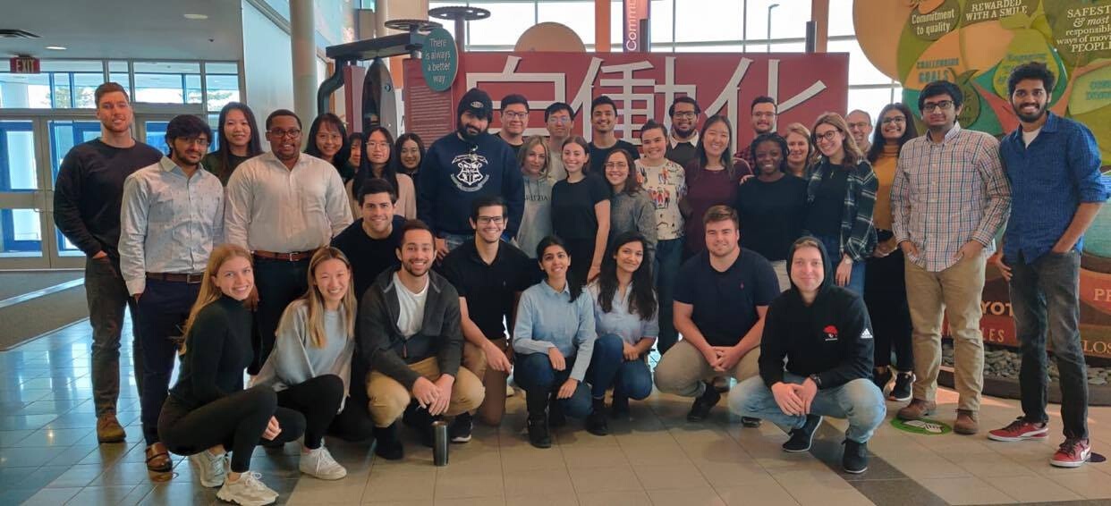 Group of student posing in an office