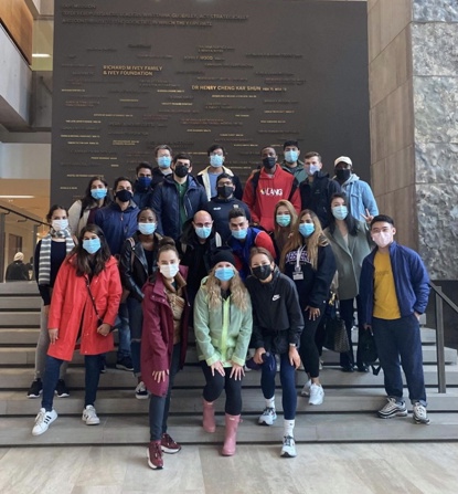 Youmi and her friends standing on the stairs in the Ivey building