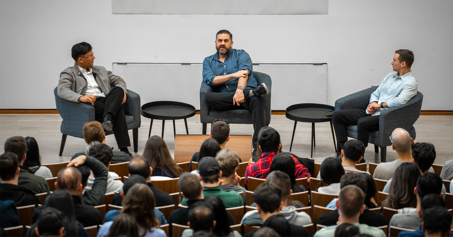 Leading with AI panel (l-r): MBA students Arham Ali (left) and Calvin Zehr led a Q&A with Paul Rogozinski (centre)