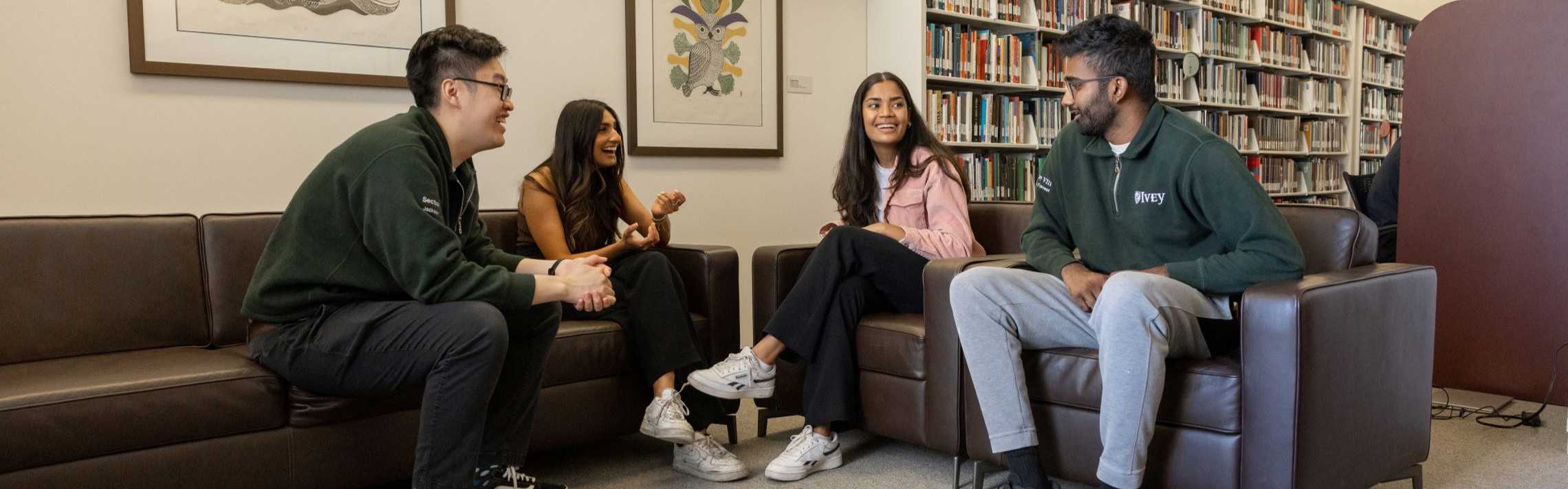 Students talking together in the library 