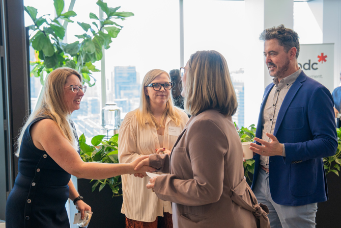 Attendees networking at the event