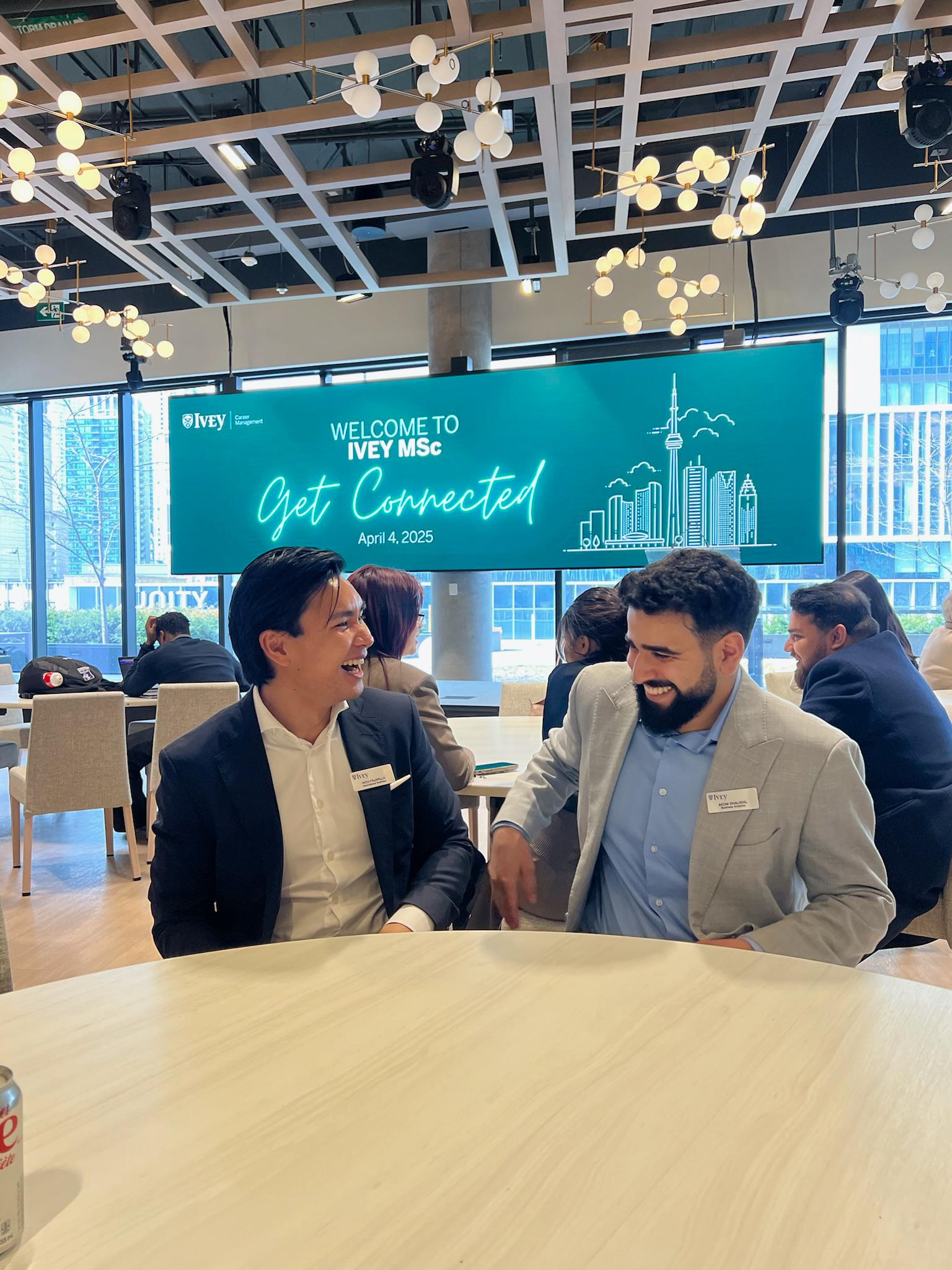 Sitting and waiting for the MScA presidents' speech at Get connected, April 2024. Nico Fajarillo (NHH Dual Degree) and Akom Dhaliwal