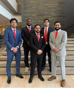 A group of male students posing in red ties