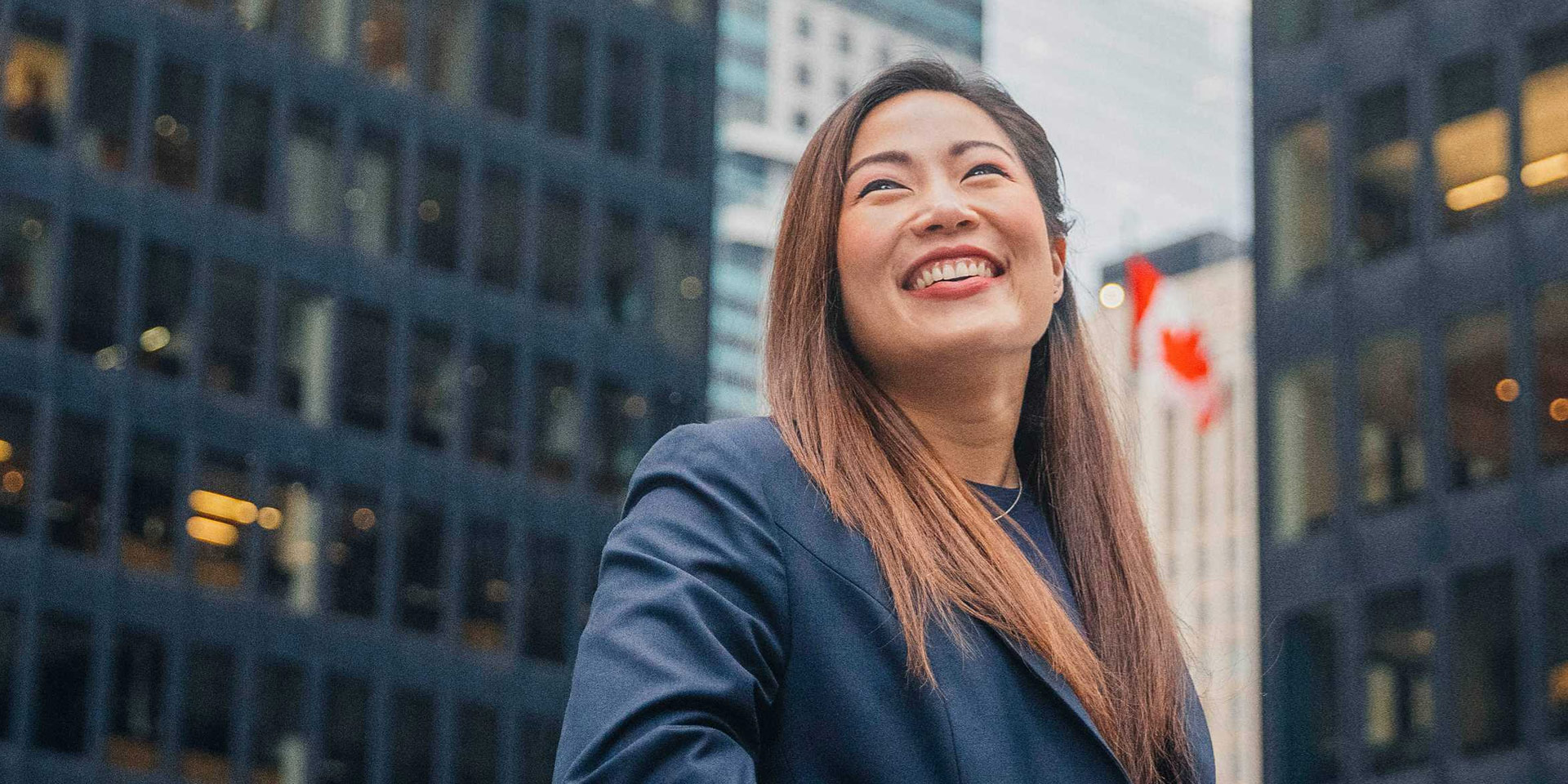 A woman standing in downtown Toronto