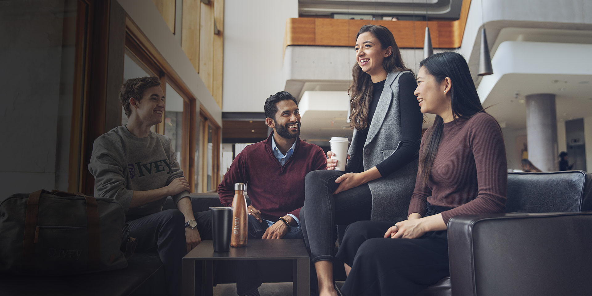 A group of students talking in the Ivey Business School