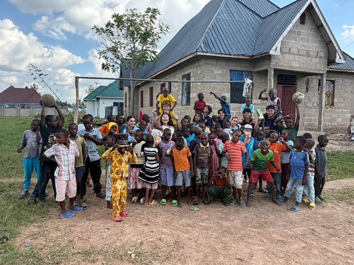 The Service Learning in Africa cohort with children in Tanzania