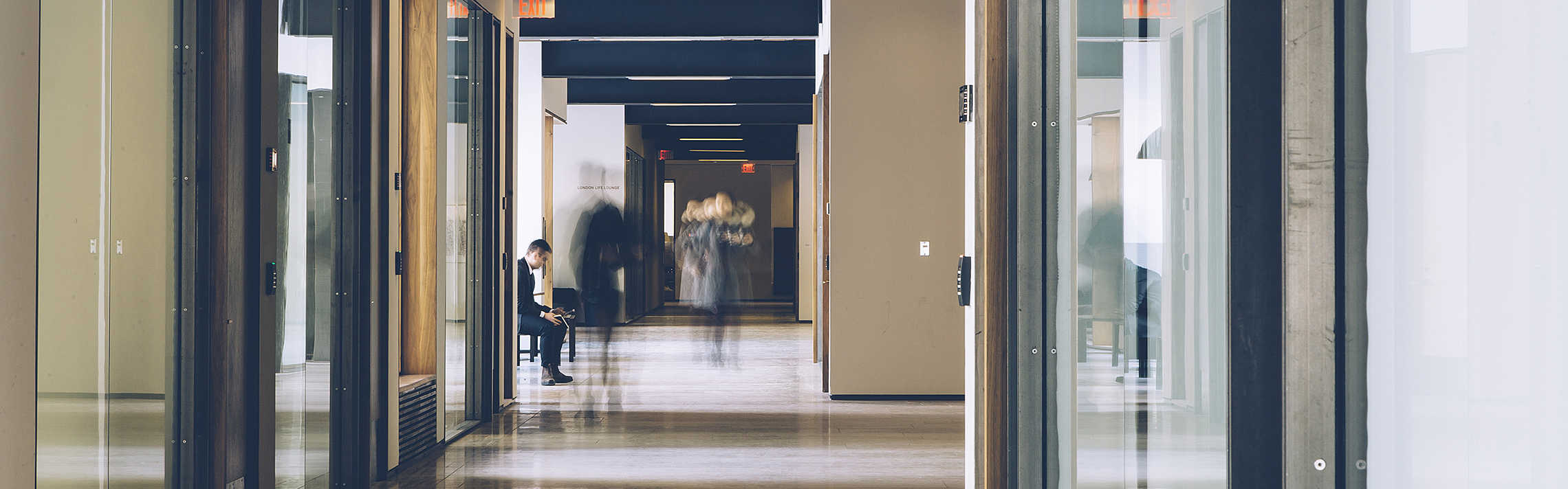 An abstract teal-to-dark-green web banner featuring flowing mesh waves, glowing nodes, and network lines that evoke artificial intelligence, data flow, and digital connectivity.