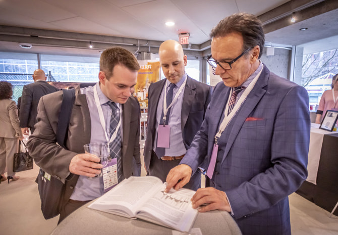George Athanassakos reviewing his book with AGM attendees