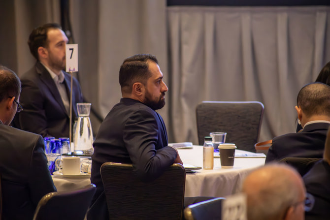 Audience member watching morning keynote speaker