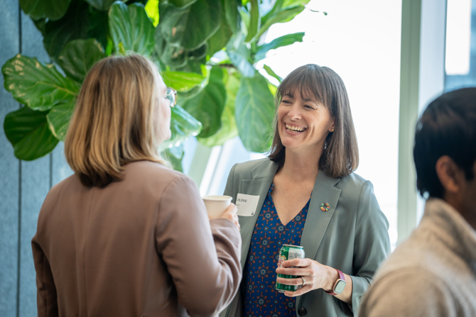 Attendees networking at the event