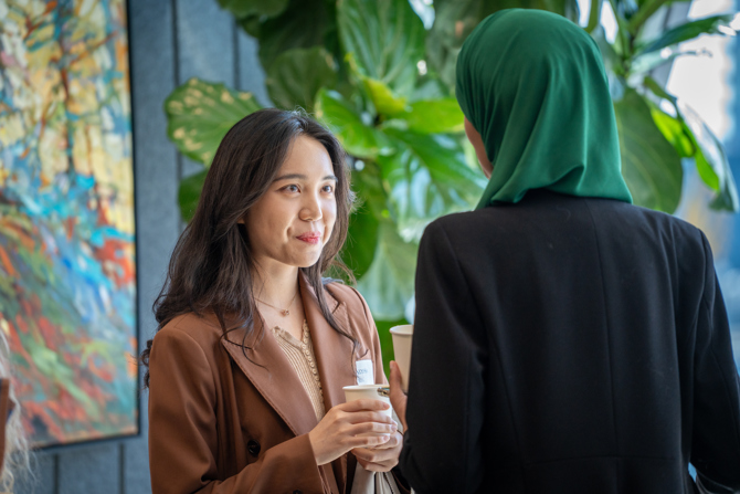 Attendees networking at the event