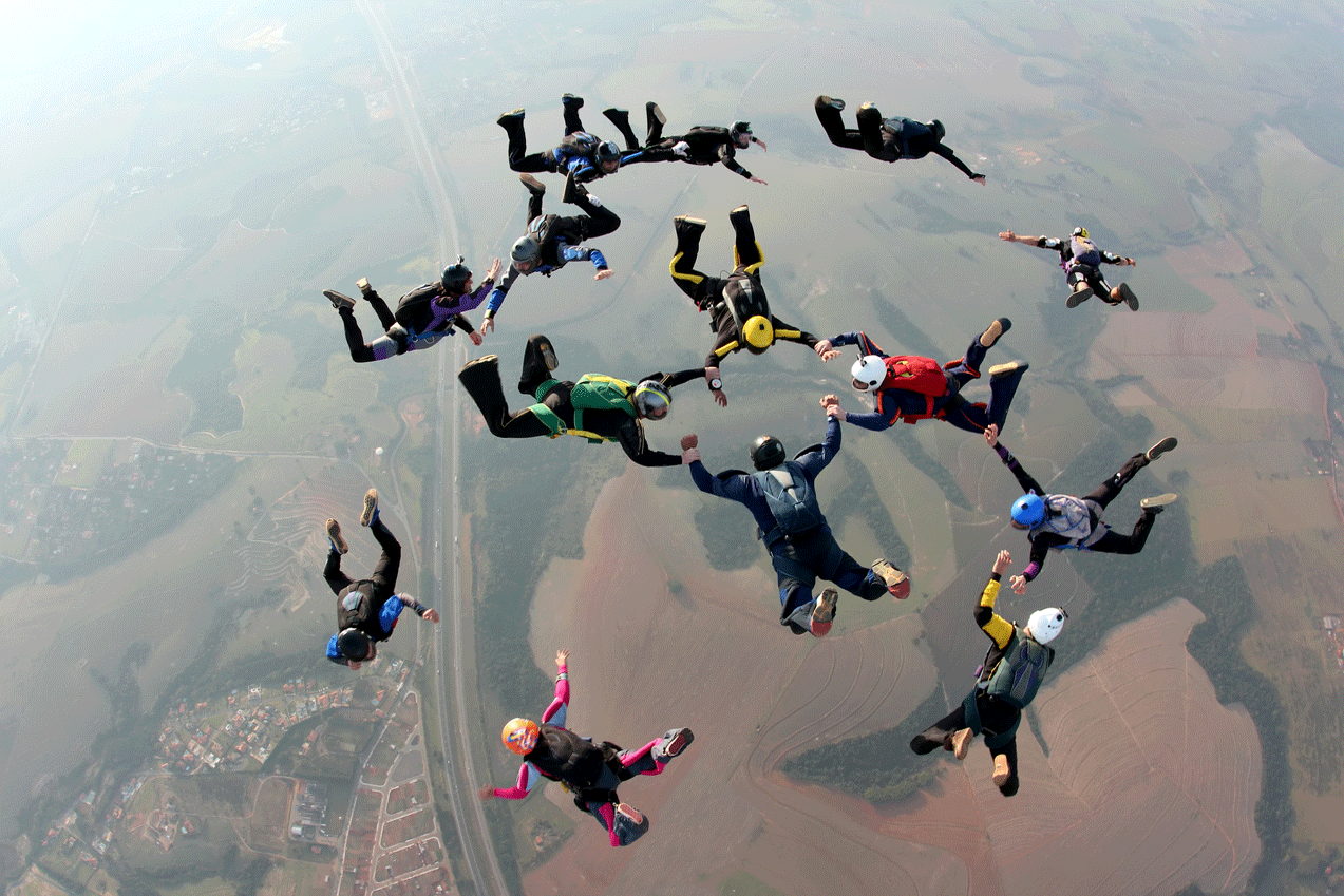 Group of Skydivers holding hands in circle