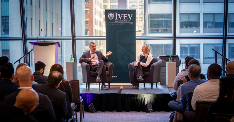 Jaime Tatis speaking with EMBA participant Amy Syed