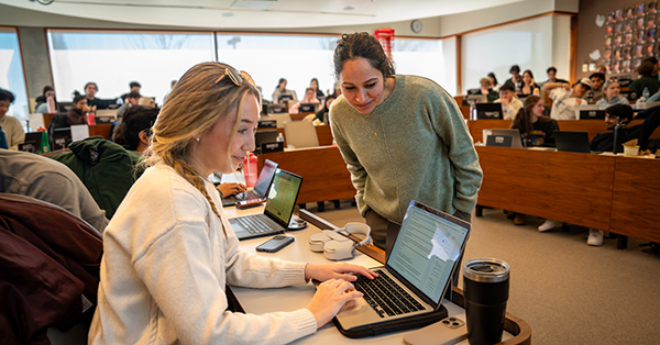 Ivey Assistant Professor Guneet Kaur Nagpal works with HBA student Lily Abboud during a generative AI simulation designed to help students question – not just use – artificial intelligence.