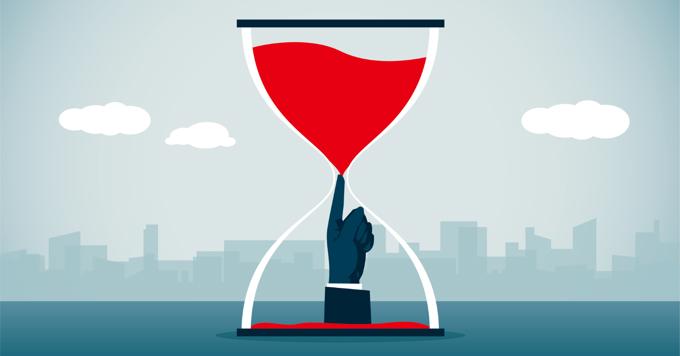 Graphic Of Hour Glass With Hand Blocking Red Sand