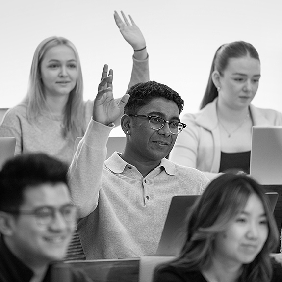 Black and white image of students in a class