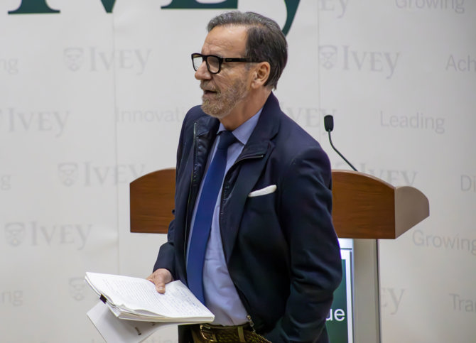 George Athanassakos introducing Dennison Veru's presentation