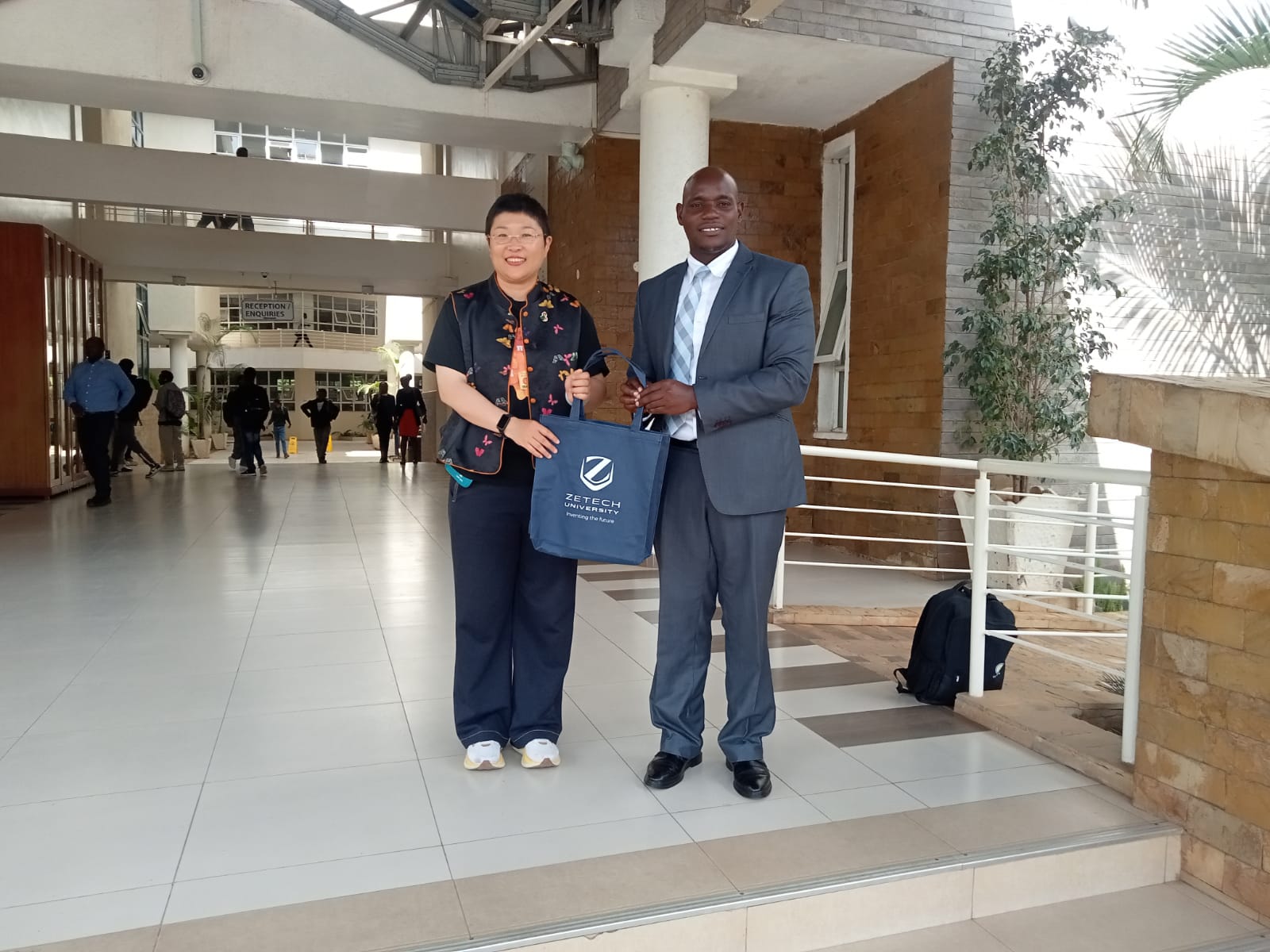 Prof Liu being presented a gift