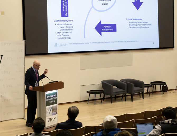 Dennison Veru presentation with PPT screen