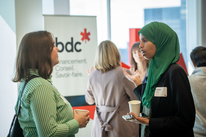 Attendees networking at the event